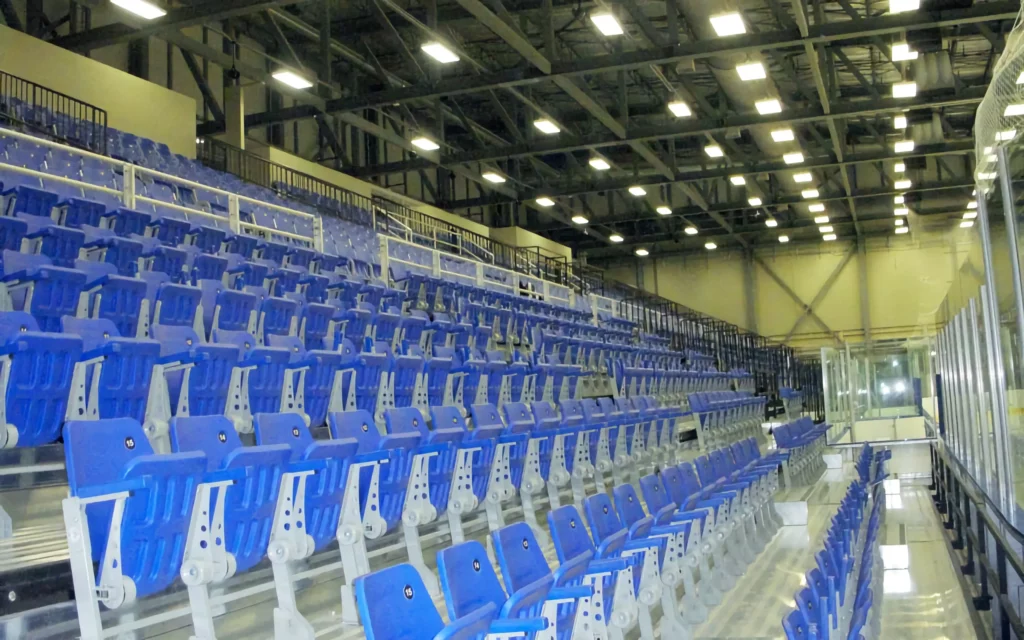 Blue arena indoor bleacher seats.